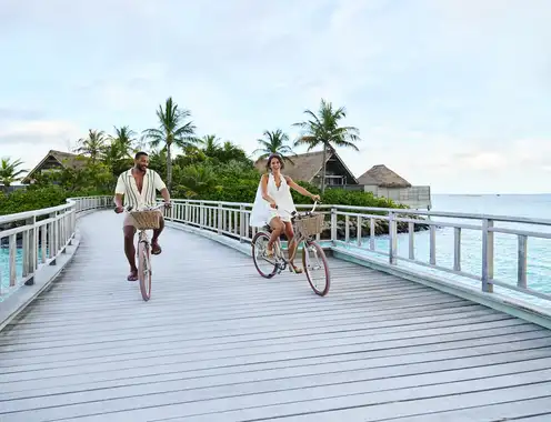 Conrad Maldives Rangali Island Guests Riding Bicycles
