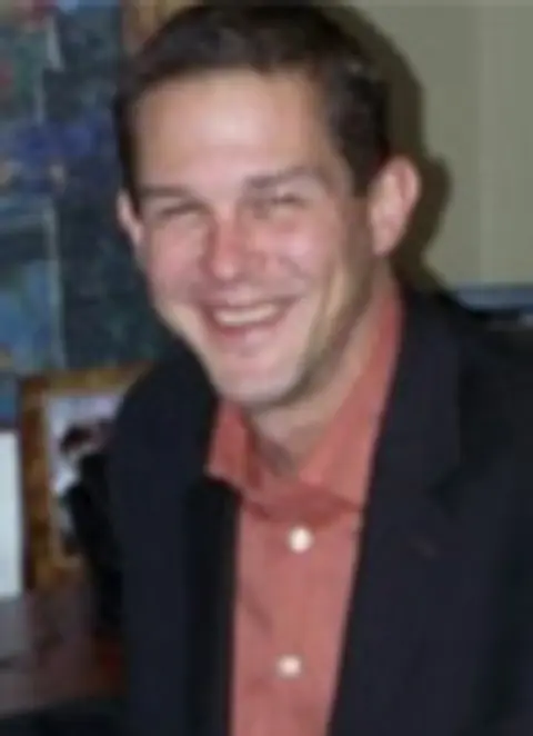 Mark J. Mathews