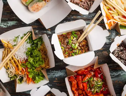 Besides helping the environment, what other benefits can restaurants see from green food packages?
