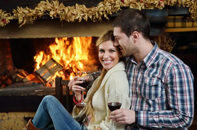 Romantic couple at a fireplace