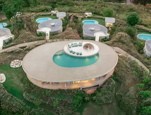 onion expands nature-inspired resort with pool villas atop thai mountains